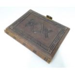 A Victorian photograph album containing various portrait photographs Please Note - we do not make