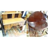 A 20thC walnut writing desk, the top with leather insert, letter rack, drawers, cupboards, etc.