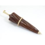 A Victorian treen and bone needle case formed as an umbrella. Approx 4" long Please Note - we do not