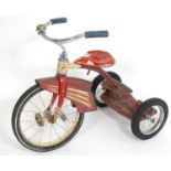A 20thC child's Murray tricycle / trike with two steps at the rear. The frame with red polychrome
