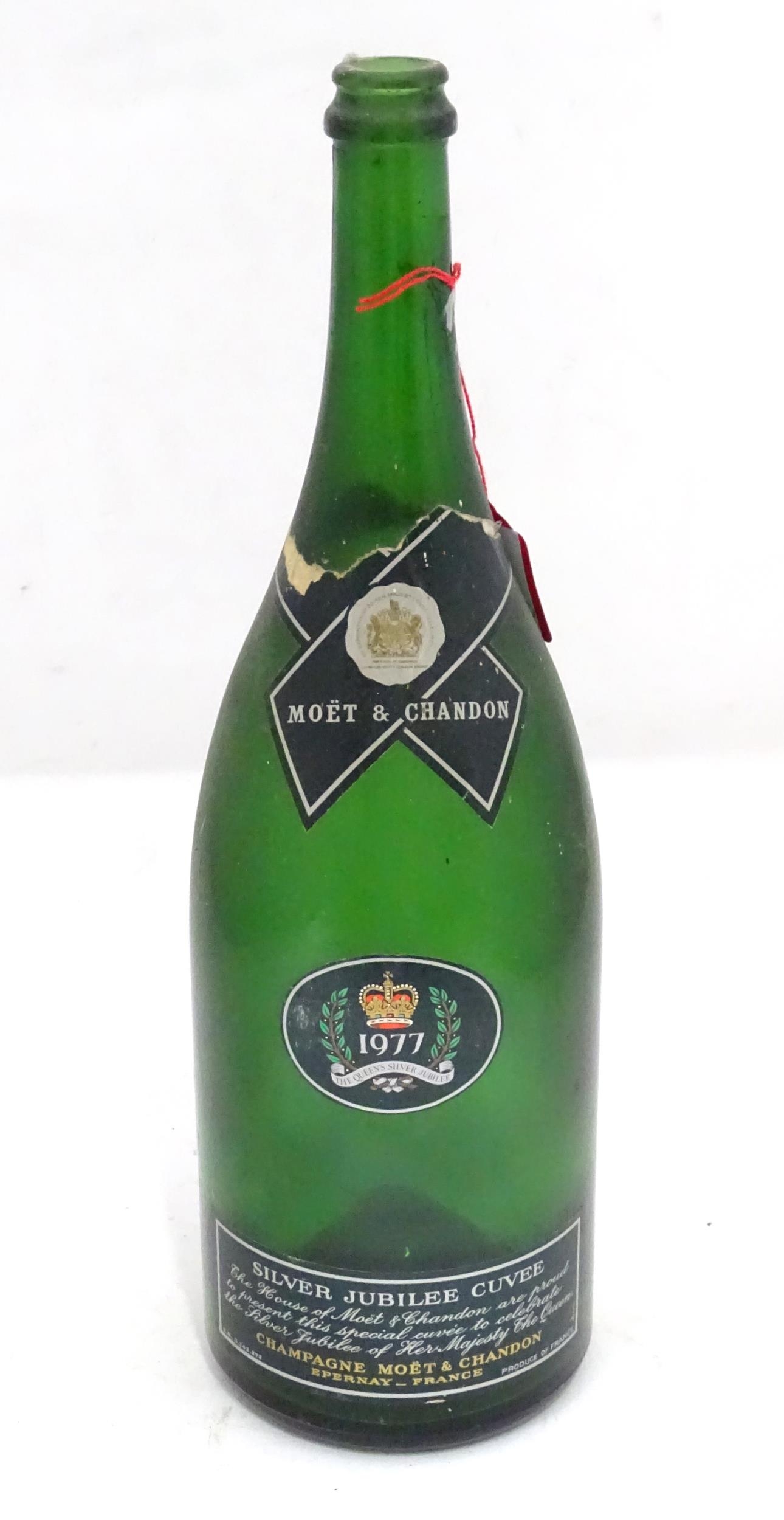 A commemorative 1977 Queen's silver jubilee Moet champagne magnum bottle Please Note - we do not