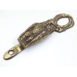 A door knocker formed as an owl. Approx 4 3/4" long. Please Note - we do not make reference to the