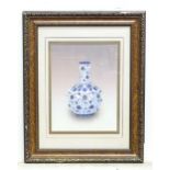 A framed embroidery / needlework depicting a Chinese blue and white bottle vase with floral and