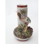 A bottle vase decorated with floral and foliate decoration and an emu in relief emu. Impressed