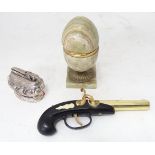 Three table lighters to include a novelty example modelled as a flintlock pistol, approx. 7 1/2"