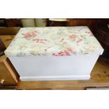 A painted pine trunk / Ottoman with upholstered top. Approx. 33" wide x 19" deep x 19" high Please