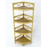 A retro bamboo four tier corner whatnot / stand. Please Note - we do not make reference to the