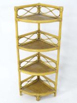 A retro bamboo four tier corner whatnot / stand. Please Note - we do not make reference to the