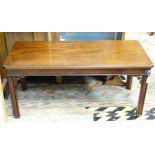 A 20thC mahogany coffee table. Approx. 18 1/2" high x 41" wide x 18" deep Please Note - we do not