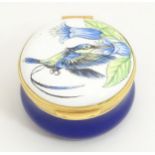 A small lidded pot / box with hummingbird decoration to top, marked under Handmade in England by