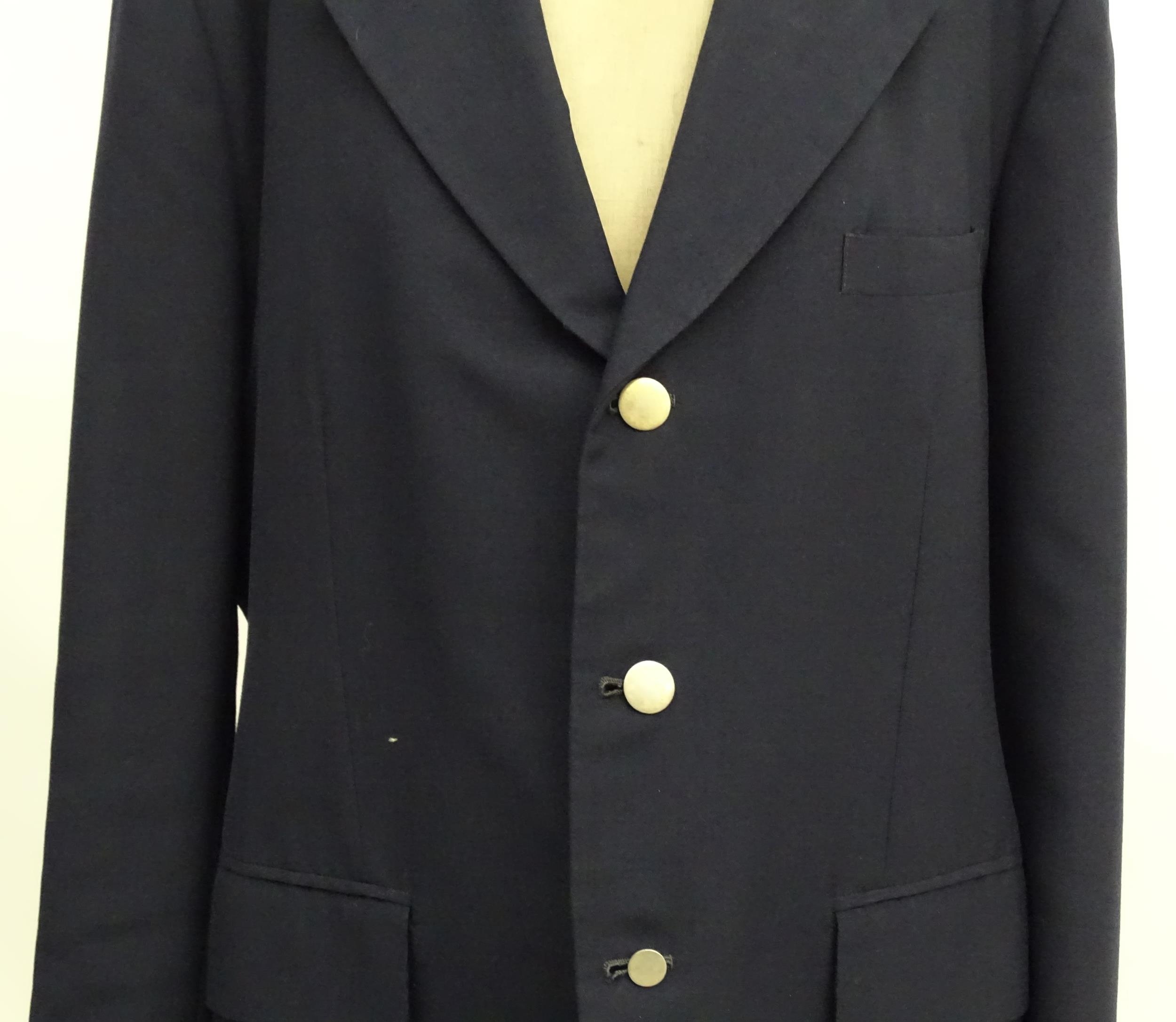 A navy blue bespoke suit with tapered trousers and metal button detail by 'Sam's Tailor' based in - Image 15 of 17