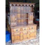 A late 20thC oak dresser. Approx. 54" wide x 19 1/2" deep x 75" high Please Note - we do not make