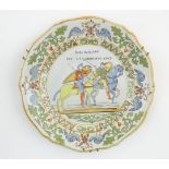 A Continental faience plate depicting a scene from the Bayeux Tapestry with Duke William leaving for