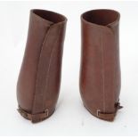 Pair of early 20thC leather gaiters. Approx 11" high Please Note - we do not make reference to the