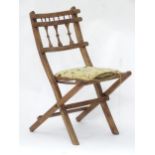 A folding / campaign chair with upholstered seat Please Note - we do not make reference to the