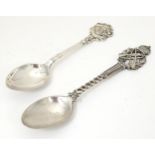 A 20thC silver plated spoon, the handle decorated with military target competition device of crossed