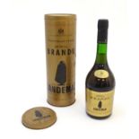 A bottle of Sandeman Imperial brandy, within a tin case, 70cl Please Note - we do not make reference