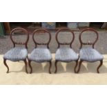 A set of four mid 19thC mahogany dining chairs with balloon backs and carved mid rails. Approx. 33