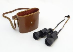 A cased pair of Barr & Stroud 'CF.43' 10x field glasses / binoculars, 6" long Please Note - we do