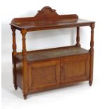 A 19thC mahogany buffet with a shaped upstand above four turned tapering supports and two panelled