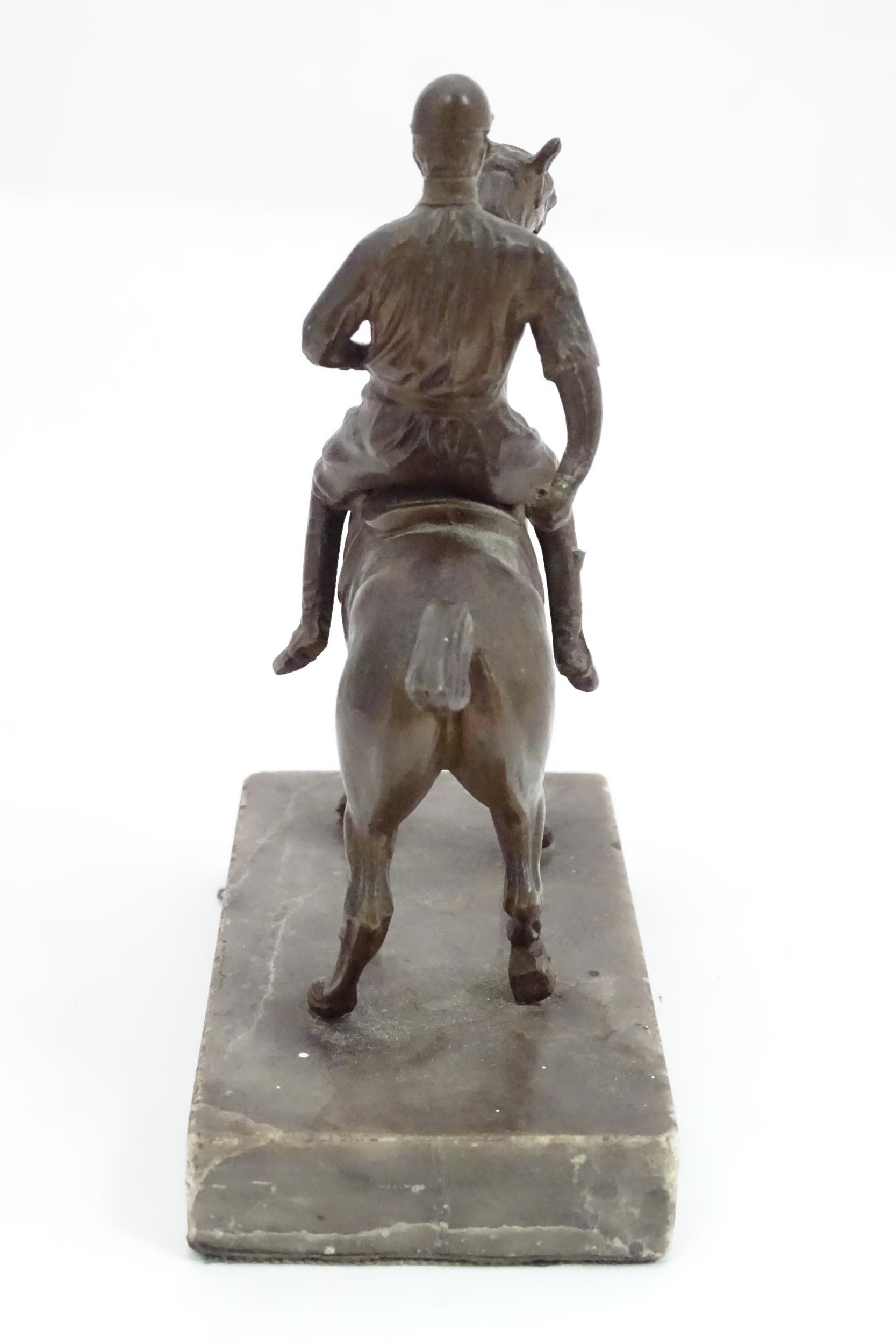 A 20thC cast sculpture modelled as a jockey on horseback, upon a marble base. Approx. 5 1/2" high - Image 4 of 5