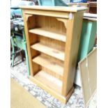 A modern pine four tier bookcase. Approx. 29 1/2" wide x 11" deep x 47 3/4" high Please Note - we do