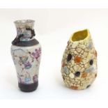 An asymmetrical Sylvac vase with pebble decoration. Impressed marks to base. Approx. 6 1/2'' high.