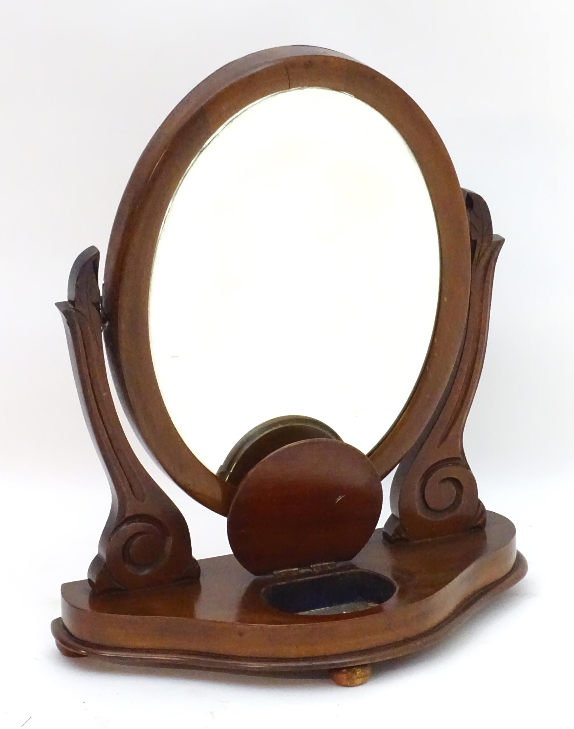 A Victorian mahogany toilet mirror with an oval mirror and shaped surrounds above a moulded base - Image 5 of 6
