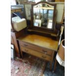An early 20thC dressing table, the upstand with mirror and shelf above two drawers. Approx. 36" high