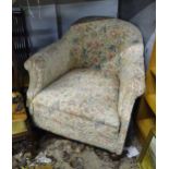 An early 20thC upholstered armchair. Approx. 28 1/2" high x 32" wide Please Note - we do not make