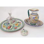 Five Continental ceramic items to include a charger with floral decoration, a twin salt modelled