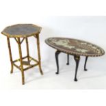 An early 20thC Indian occasional table the oval top with inlaid decoration. Together with an early