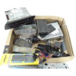 A box of electronic equipment including car radio / cassette players (Peugeot and Jeep Cherokee), TV