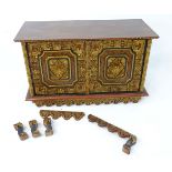 Oriental cabinet with 2 doors and having carved detail and decorated with geometric floral motifs.