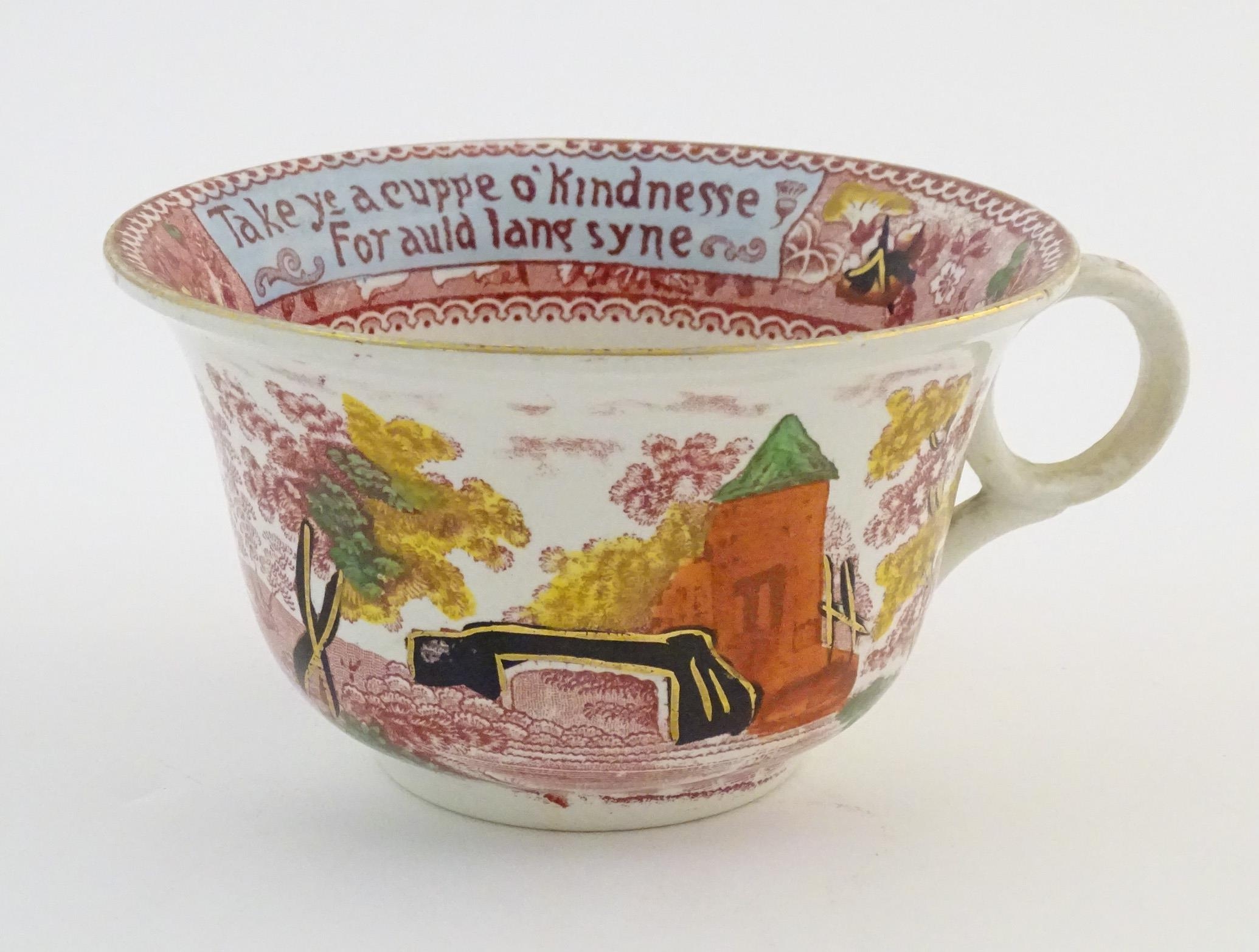 An oversized Burslem cup and saucer decorated with a bridge and tower in a landscape with the - Image 4 of 11