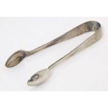 Silver sugar tongs hallmarked Glasgow 1926, maker James Weir. Approx. 4" long Please Note - we do