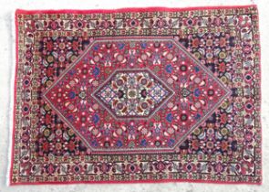 Carpet / Rug : A Bidjar rug with red, cream and blue ground with floral, foliate and geometric