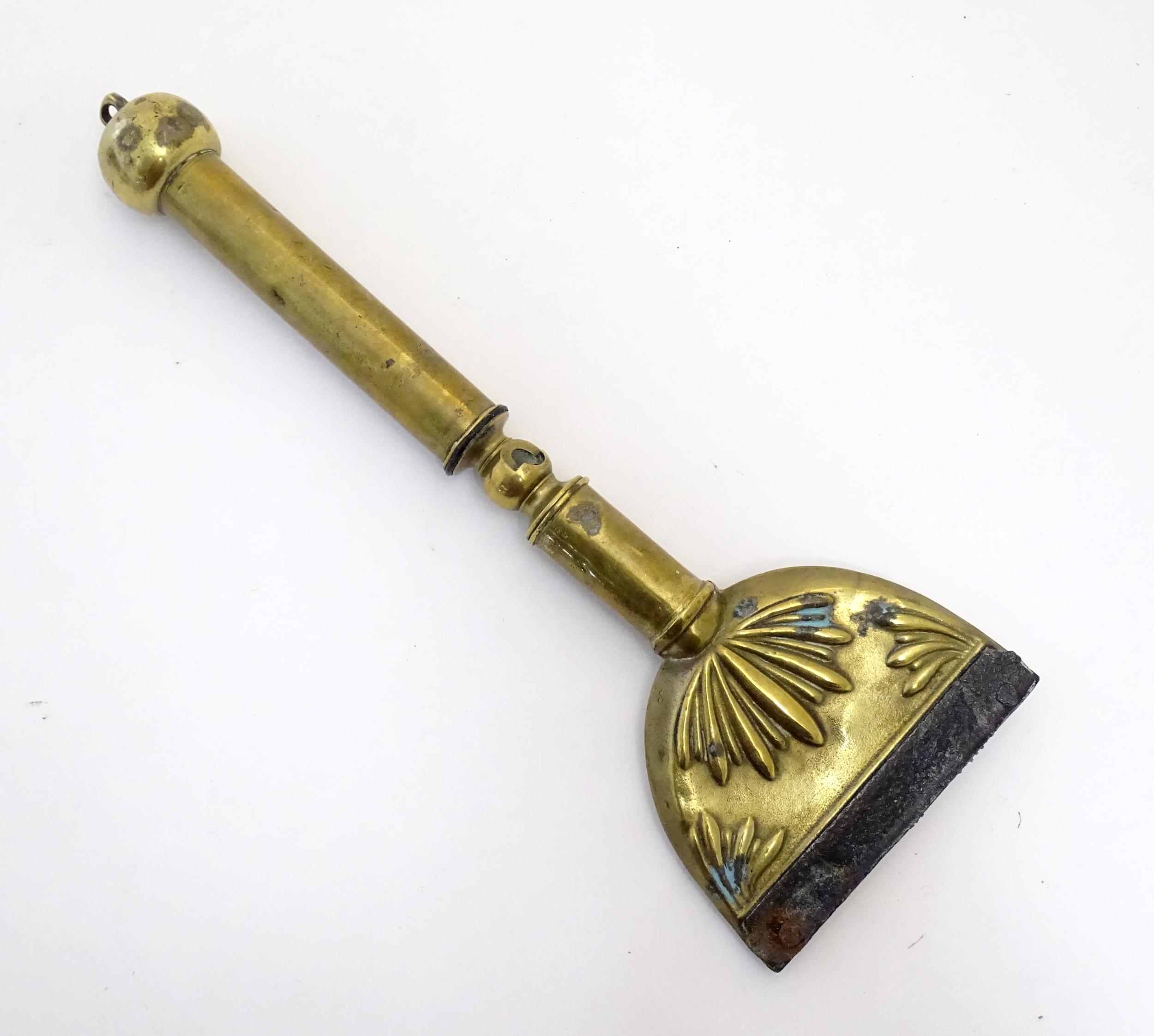 A 19thC brass horse hair singer / singeing lamp with embossed shell detail. Approx. 13 3/4" long