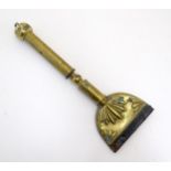 A 19thC brass horse hair singer / singeing lamp with embossed shell detail. Approx. 13 3/4" long