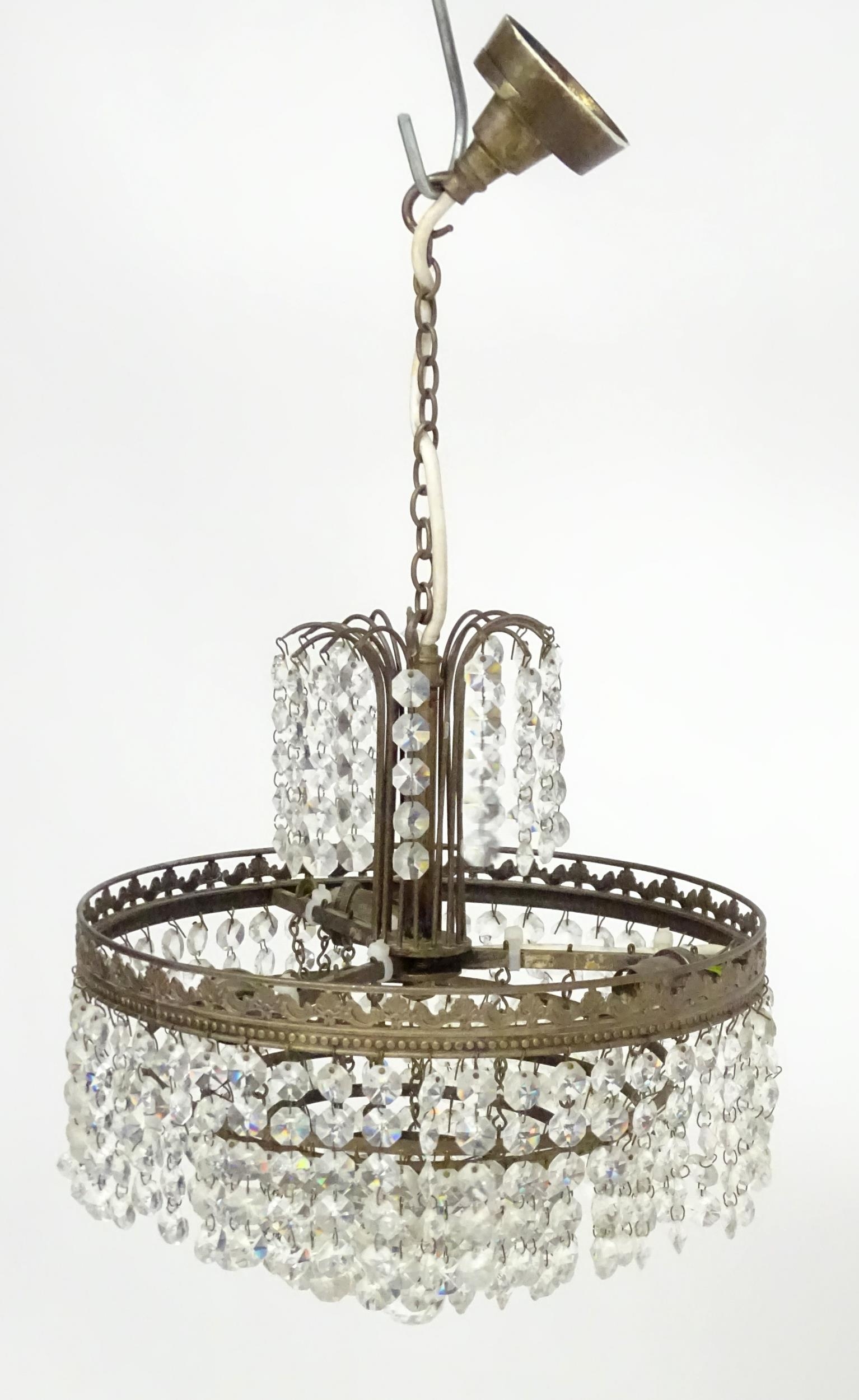 An early 20thC crystal drop bag pendant ceiling light, the chain supporting brass mounts with a - Image 3 of 8