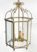 A 20thC pendant lantern ceiling light, the brass octagonal frame with bevelled glass panes, the