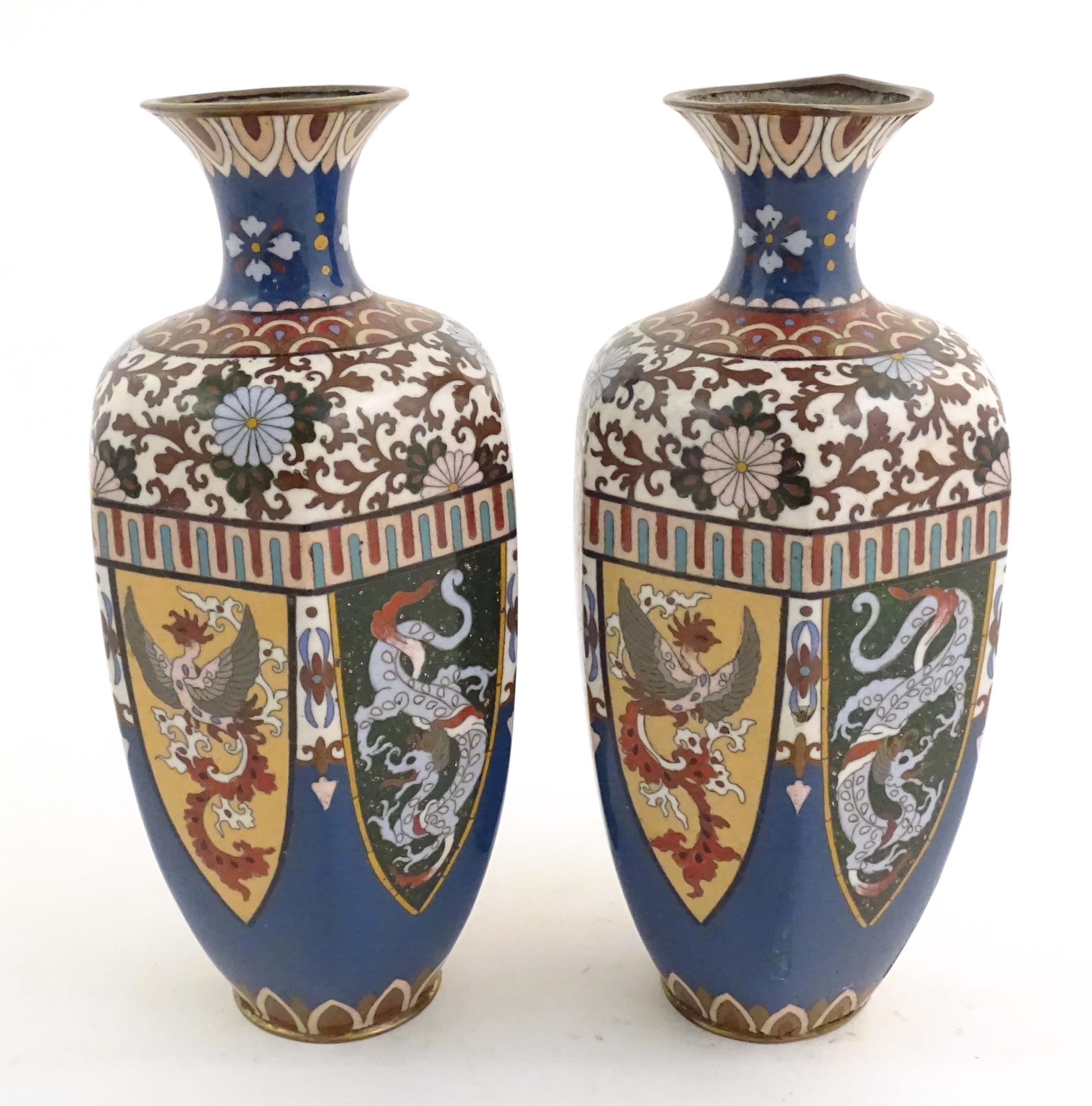 A pair of Oriental cloisonne vases decorated with panels of dragons and phoenix birds, the shoulders - Image 3 of 7