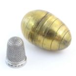 A Victorian novelty brass sewing / needlework keep / case modelled as an egg with banded detail,