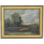 Manner of Abraham Hulk Junior (1851-1922), Oil on board, A rural landscape with a figure in a