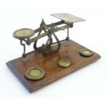 A late Victorian pair of postage scales, stamped 'Warranted Accurate', of brass construction and