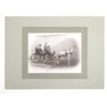 A Victorian photograph depicting figures in a horse drawn carriage. The mount with photographer's