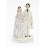 A Victorian Staffordshire pottery figural group depicting the Princess Alexandra of Denmark and
