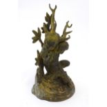 A 19thC cast brass model of a cherub / putto carrying a stag / deer head. Approx. 8 3/4" high Please