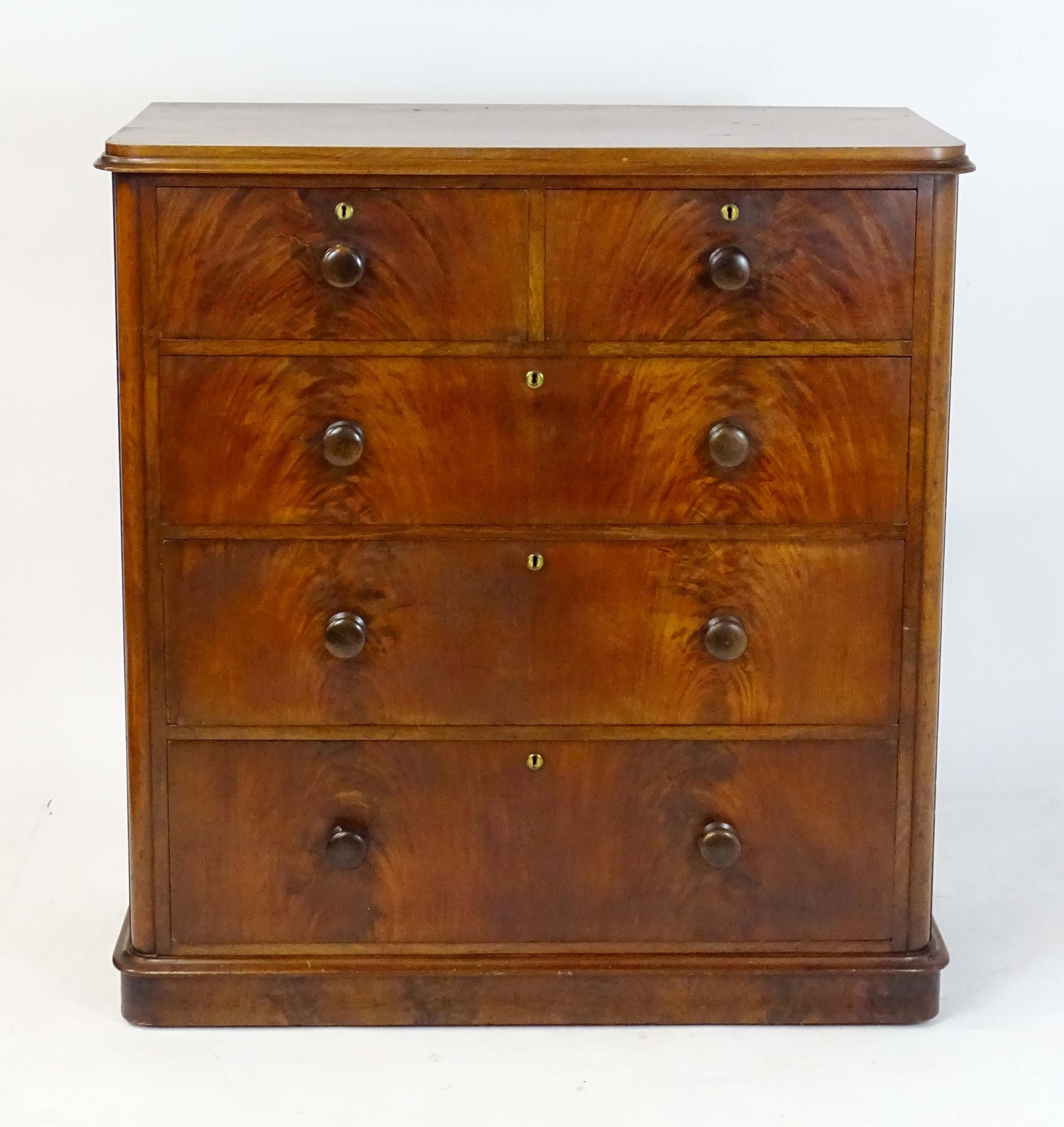 A large Victorian mahogany chest of drawers with a moulded top above two short over three long - Image 6 of 13