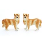 A pair of Boness pottery dogs with gilt collars. Approx. 11 1/4" high x 12 1/2" long Please Note -